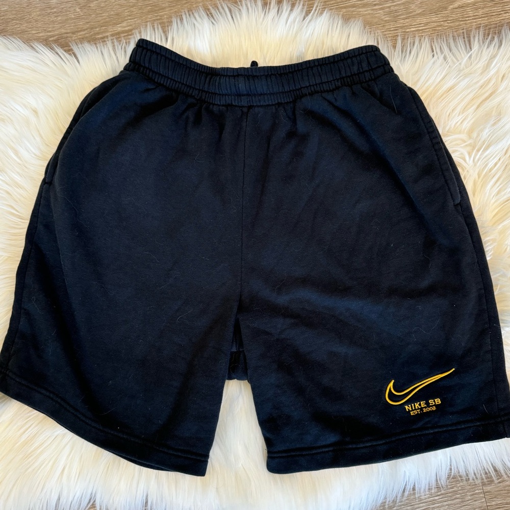 NIKE shorts with yellow logo